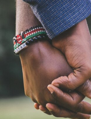 close up photo of two person s holding hands