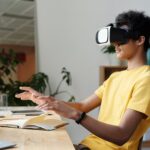 man in yellow crew neck t shirt using vr headset