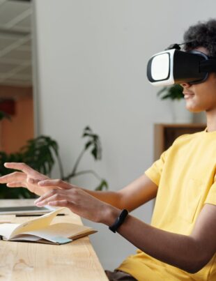 man in yellow crew neck t shirt using vr headset