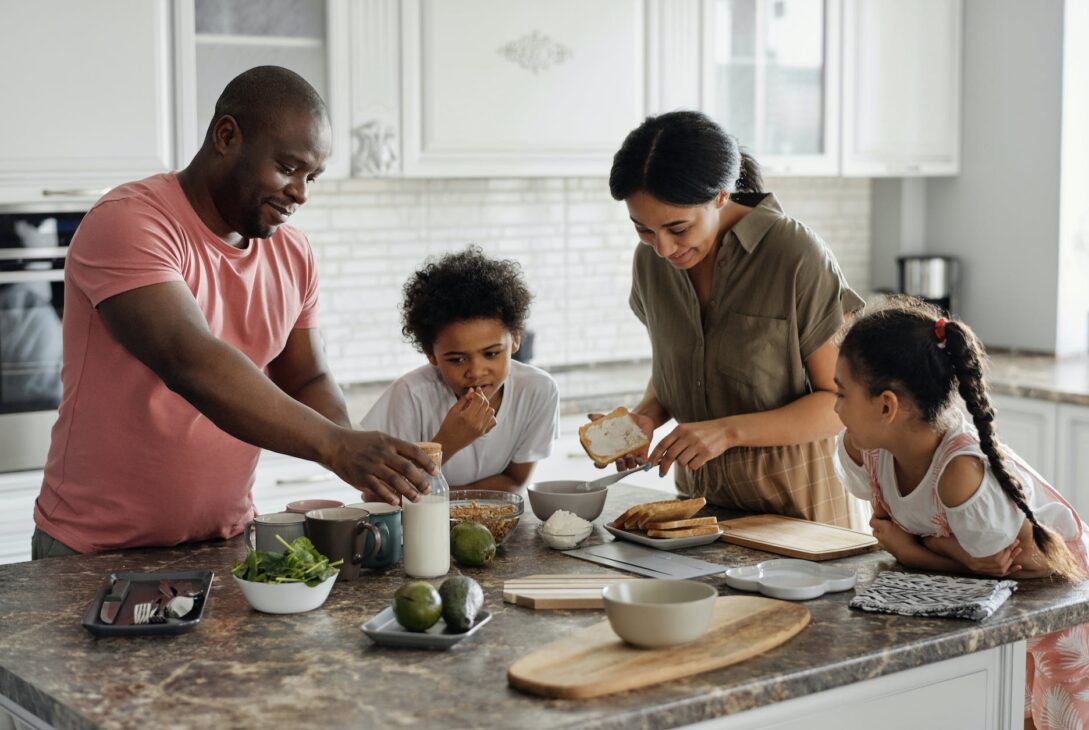 family making breakfast in the kitchen