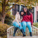 african american ladies sitting on top of wooden bench