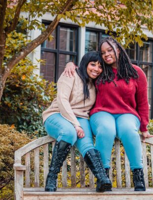 african american ladies sitting on top of wooden bench