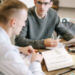 two men studying together