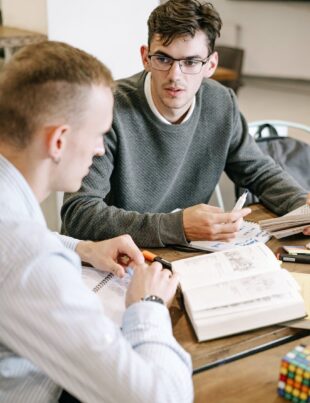 two men studying together