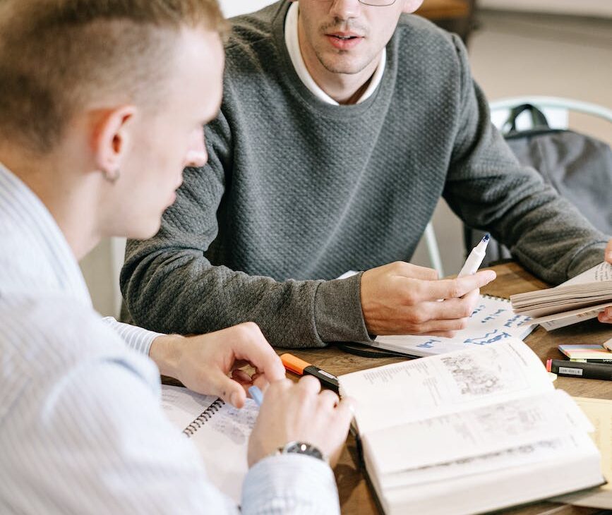 two men studying together