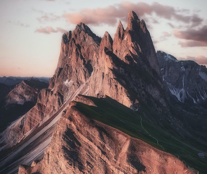 mountain range under beige sky